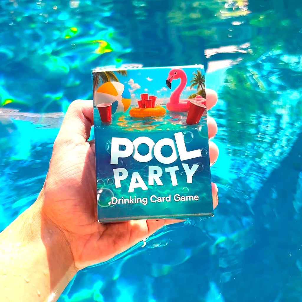 Hand holding a 'Pool Party Drinking Card Game' box with pool-themed design against a pool background.